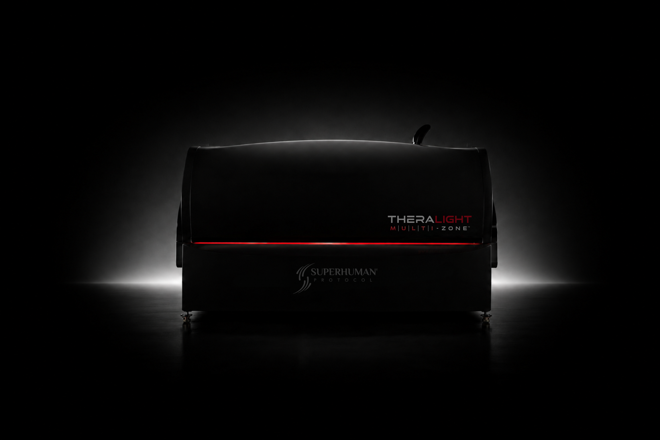 TheraLight Multi-Zone 360 with a red seam of light, white backlighting and a dark floor reflection